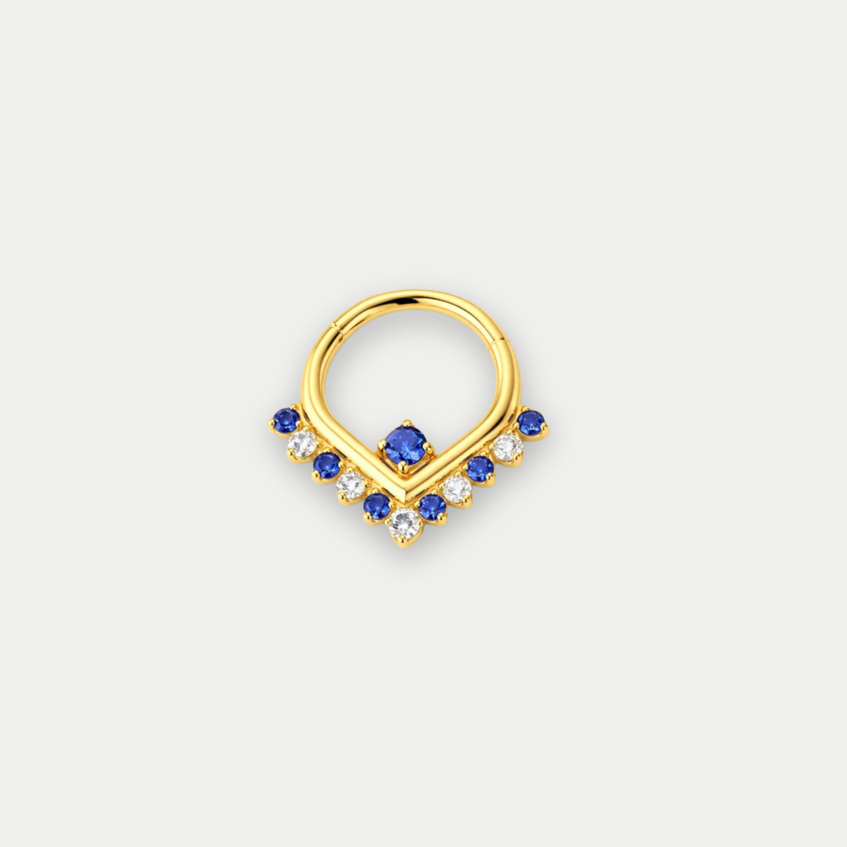 Anneau piercing Alina en titane gold avec zircon bleu, vu de face