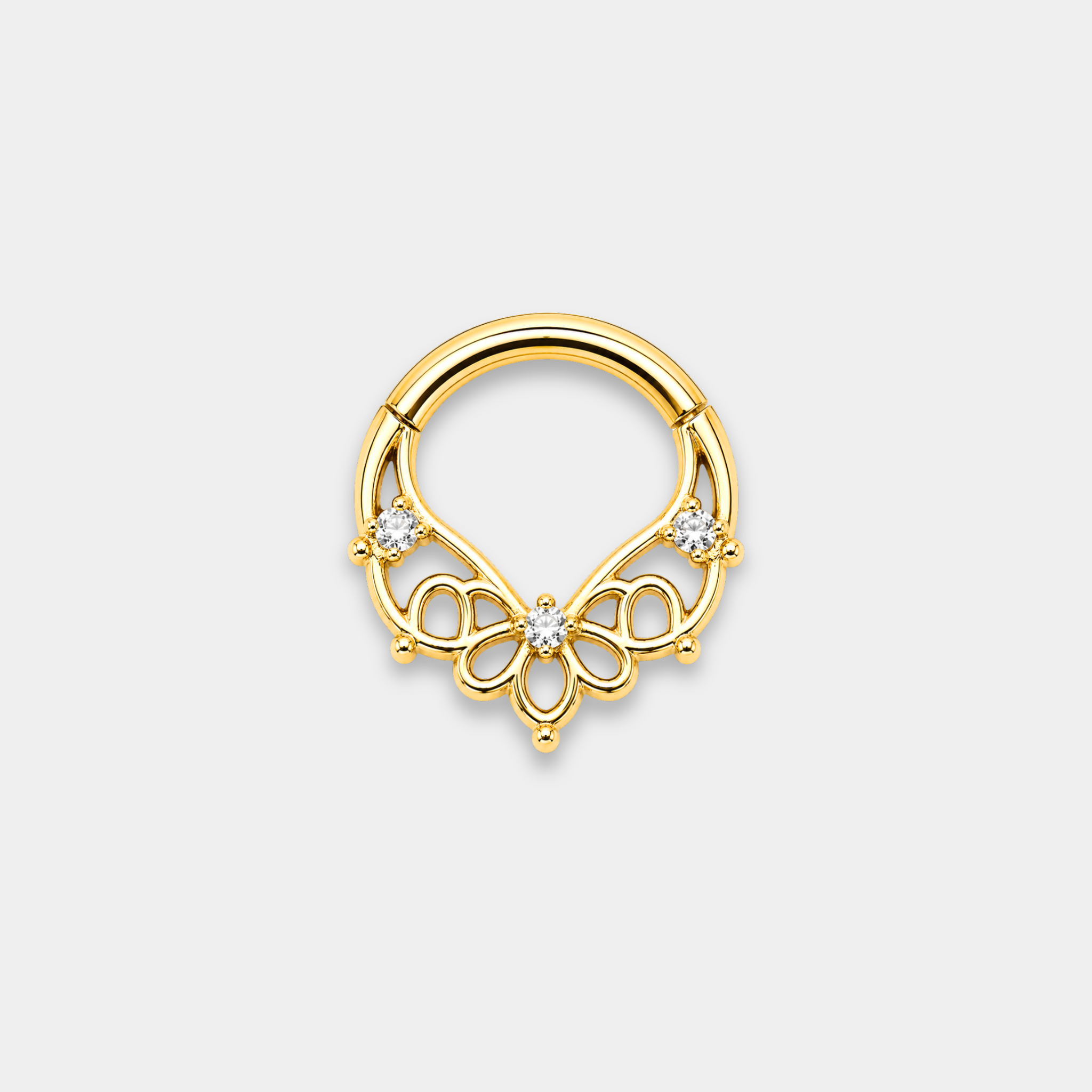 Anneau piercing Aura en titane gold avec motifs ajourés floraux et trois zircons sertis de face