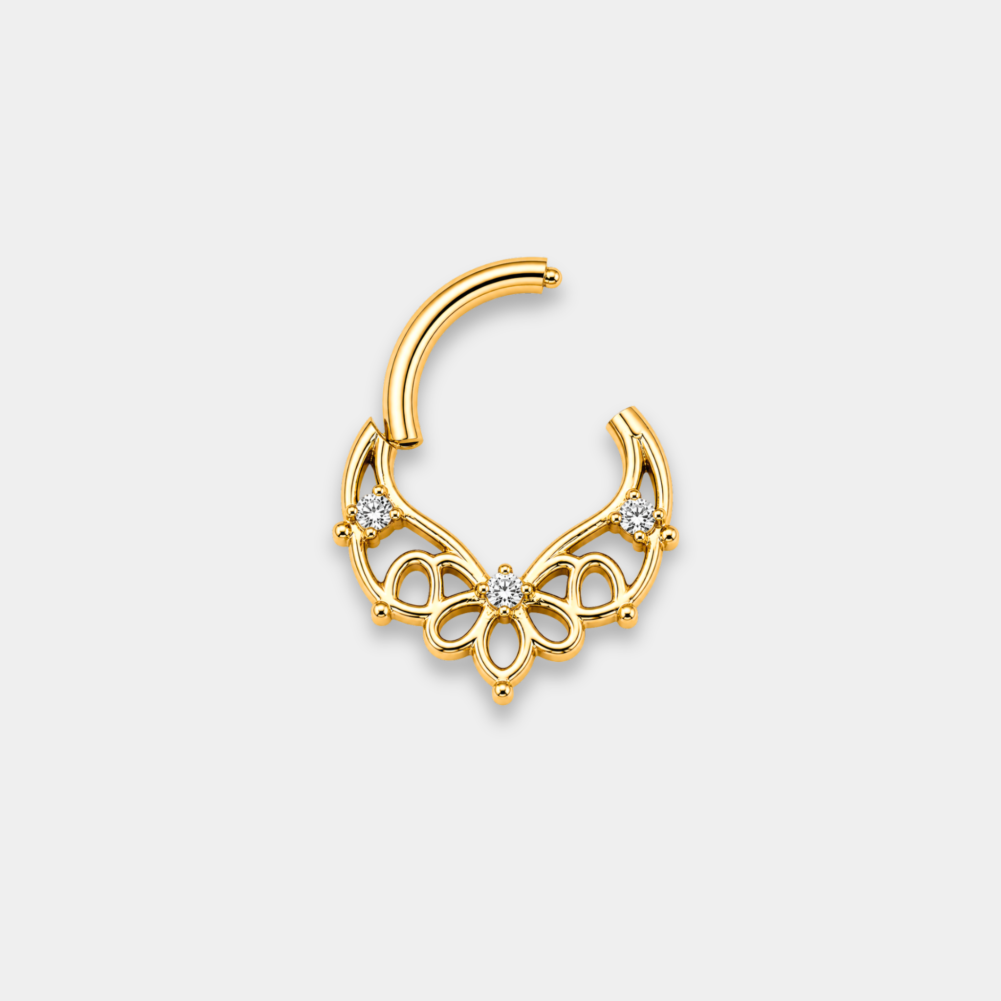 Anneau piercing Aura ouvert en titane gold avec motifs ajourés floraux et trois zircons sertis