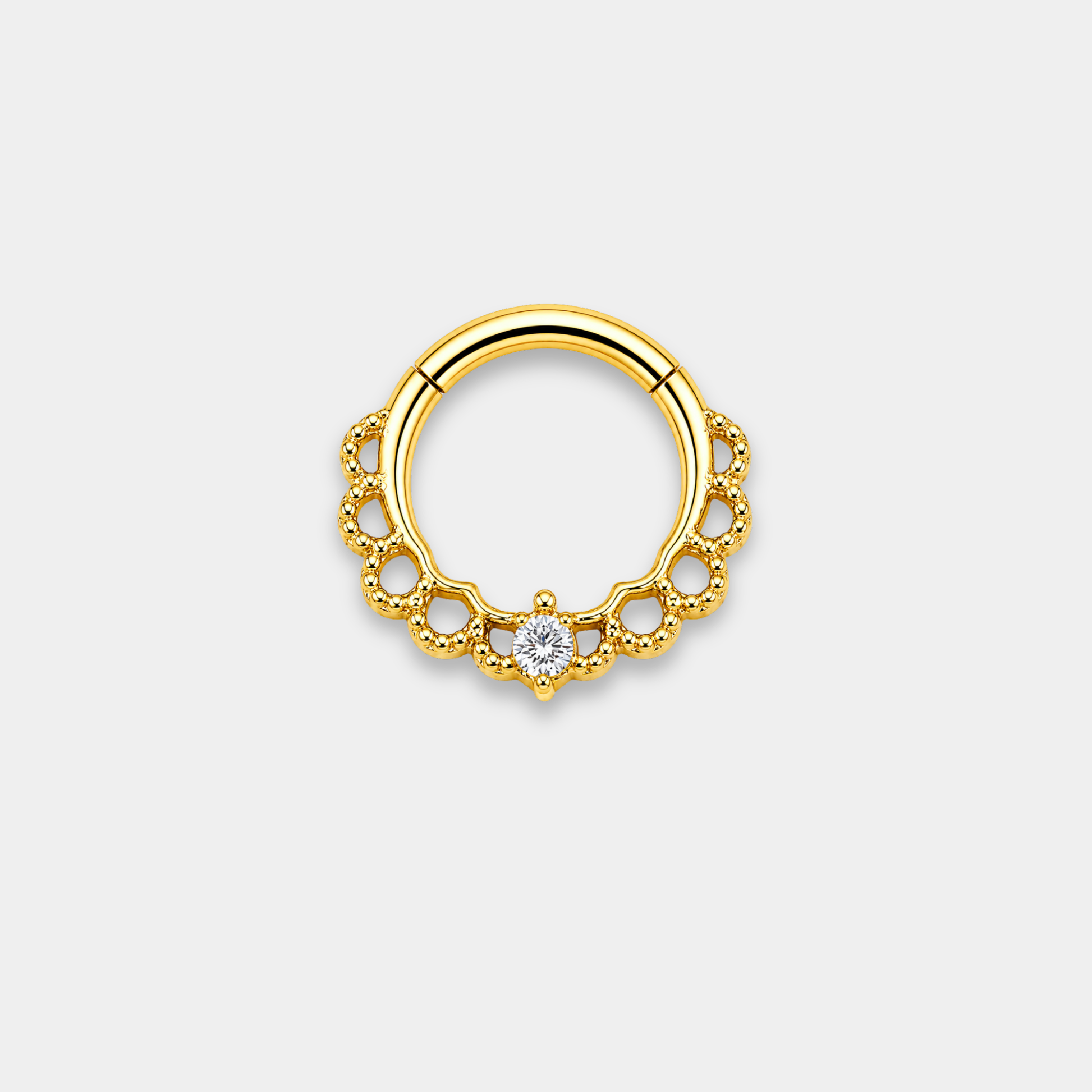 Anneau piercing Aurea en titane gold avec détails perlés ajourés et zircon central serti de face