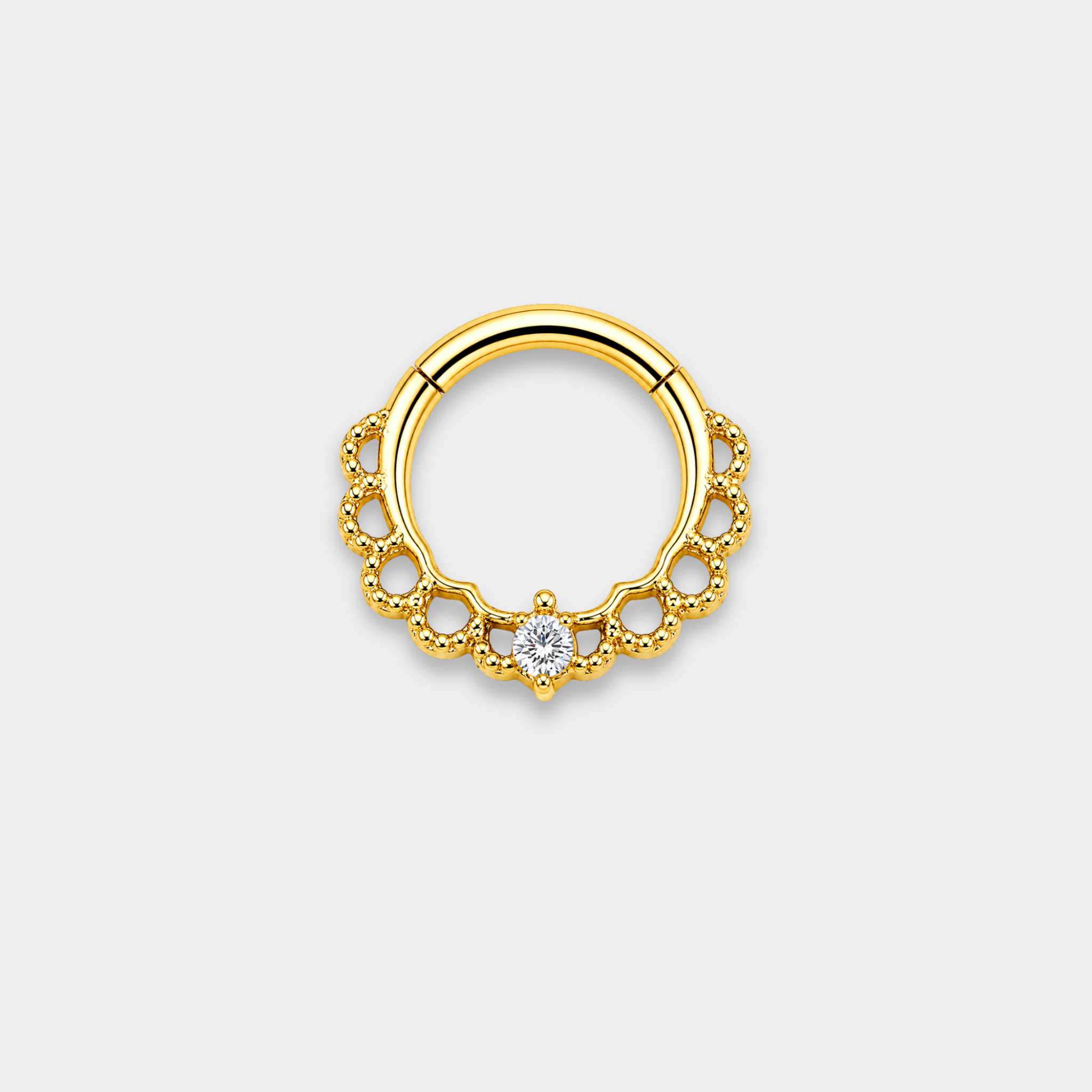 Anneau piercing Aurea en titane gold avec détails perlés ajourés et zircon central serti de face