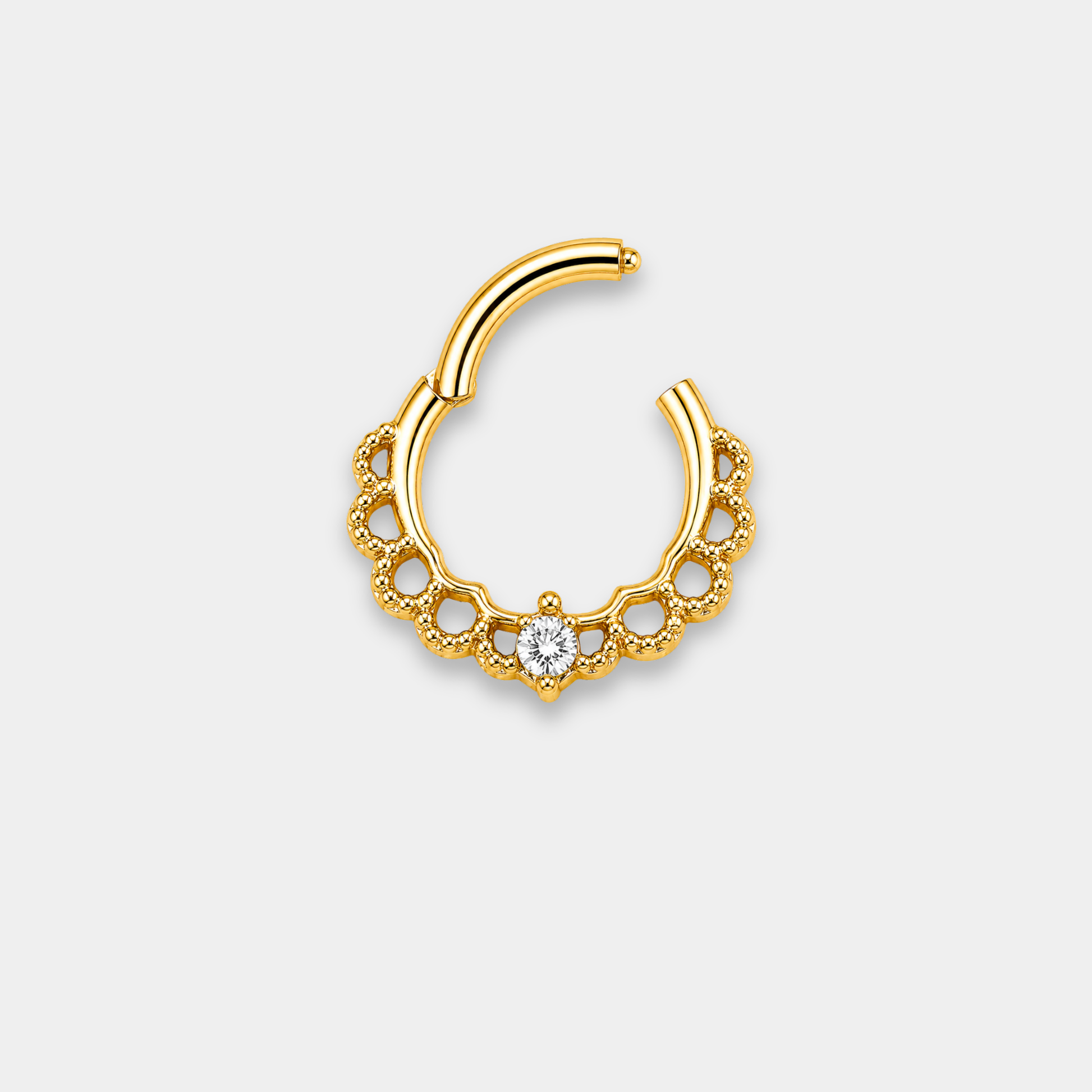 Anneau piercing Aurea ouvert en titane gold avec détails perlés ajourés et zircon central serti