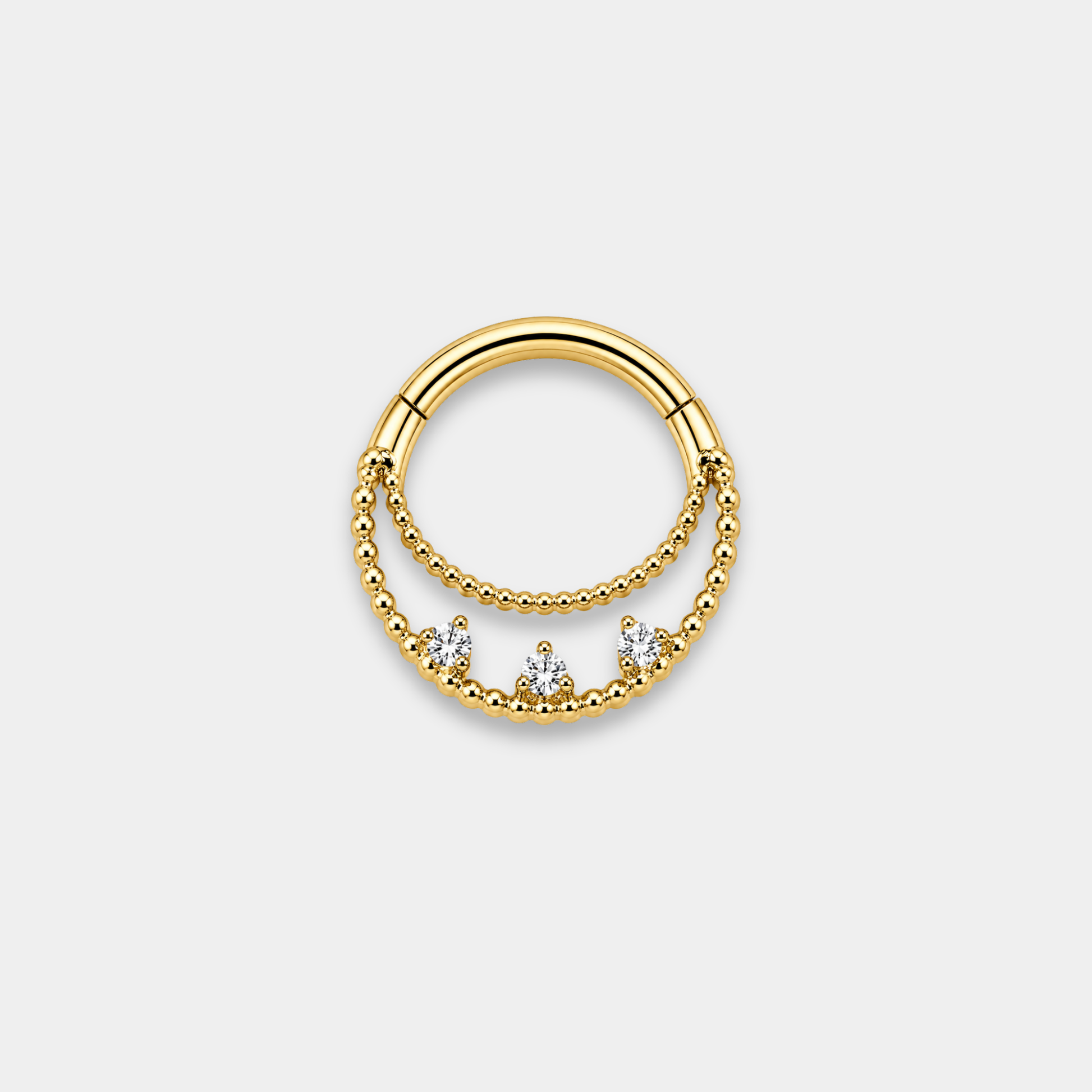 Anneau piercing Elio en titane gold avec double rangée perlée et trois zircons sertis de face