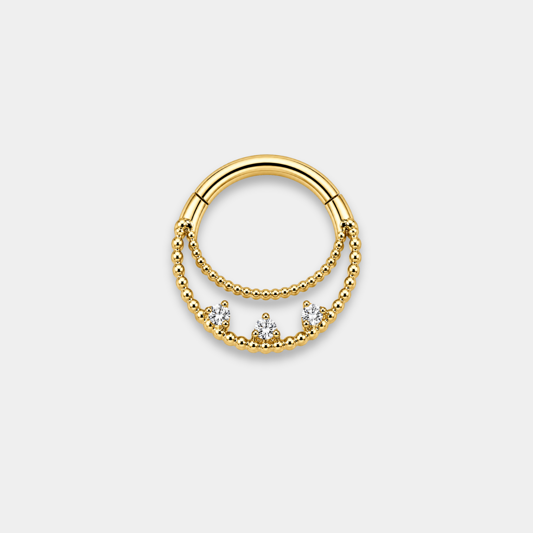 Anneau piercing Elio en titane gold avec double rangée perlée et trois zircons sertis de face