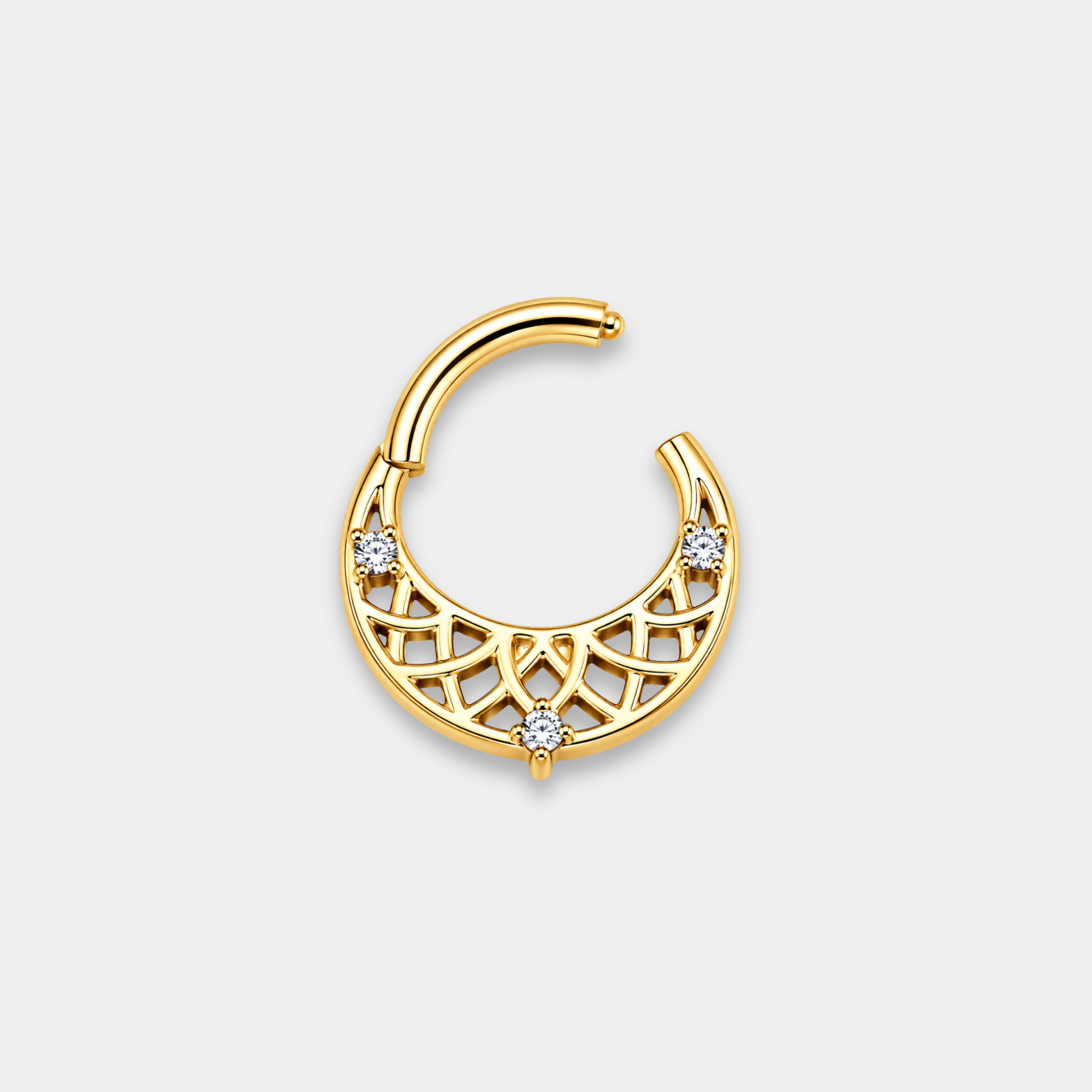 Anneau piercing Lumis ouvert en titane gold avec motifs géométriques ajourés et trois zircons sertis