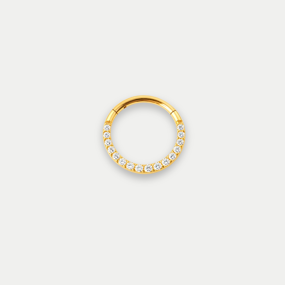 Anneau piercing Marla en titane gold avec zircon blanc, vu de face