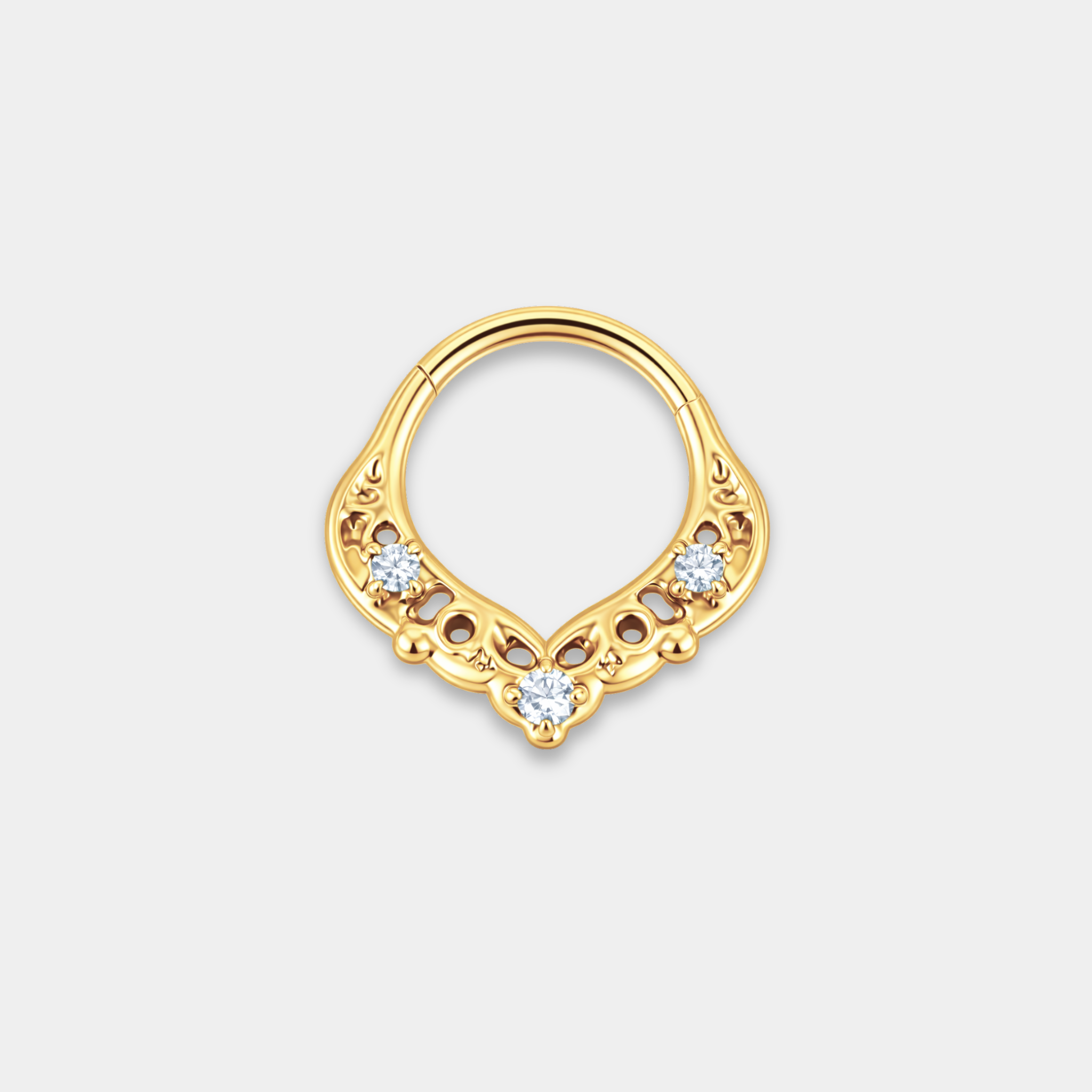 Anneau piercing Orion en titane gold avec détails ajourés délicats et trois zircons sertis de face