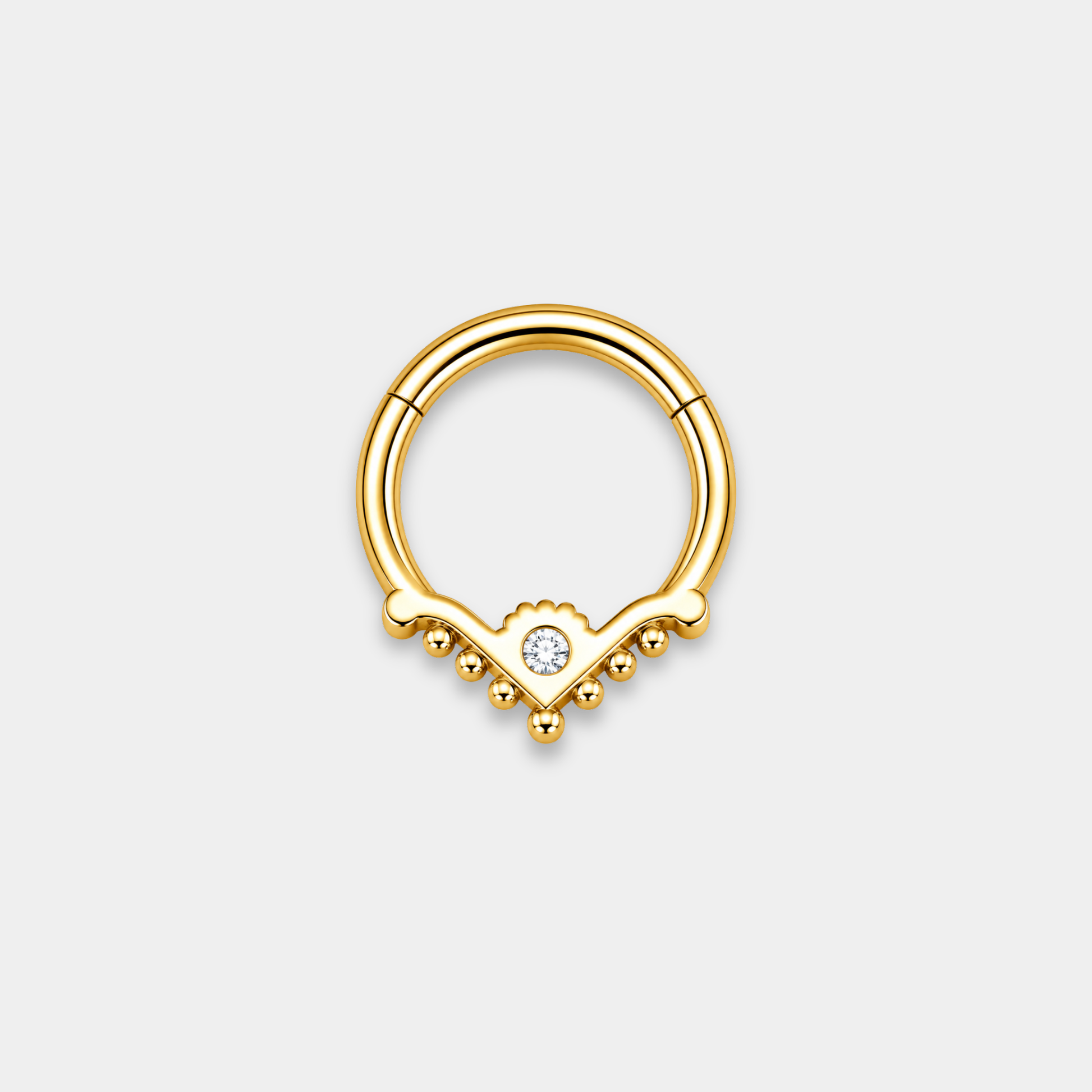 Anneau piercing Raya en titane gold vu de dos avec zircon central serti et détails perlés en forme de V