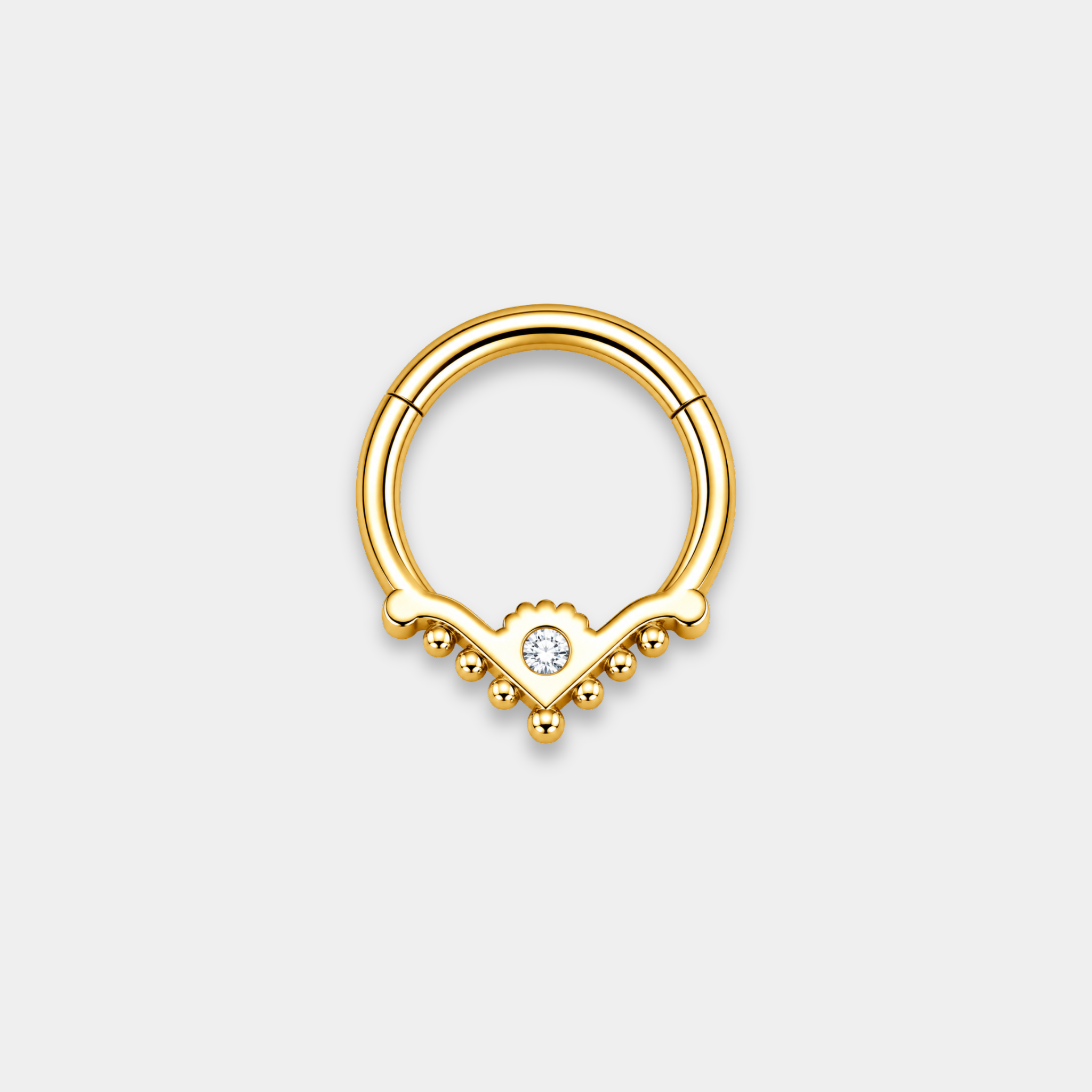 Anneau piercing Raya en titane gold vu de dos avec zircon central serti et détails perlés en forme de V