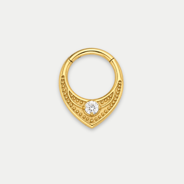 Anneau piercing Relief en titane gold, motif texturé perlé et zircon central, zircon blanc, vu de face