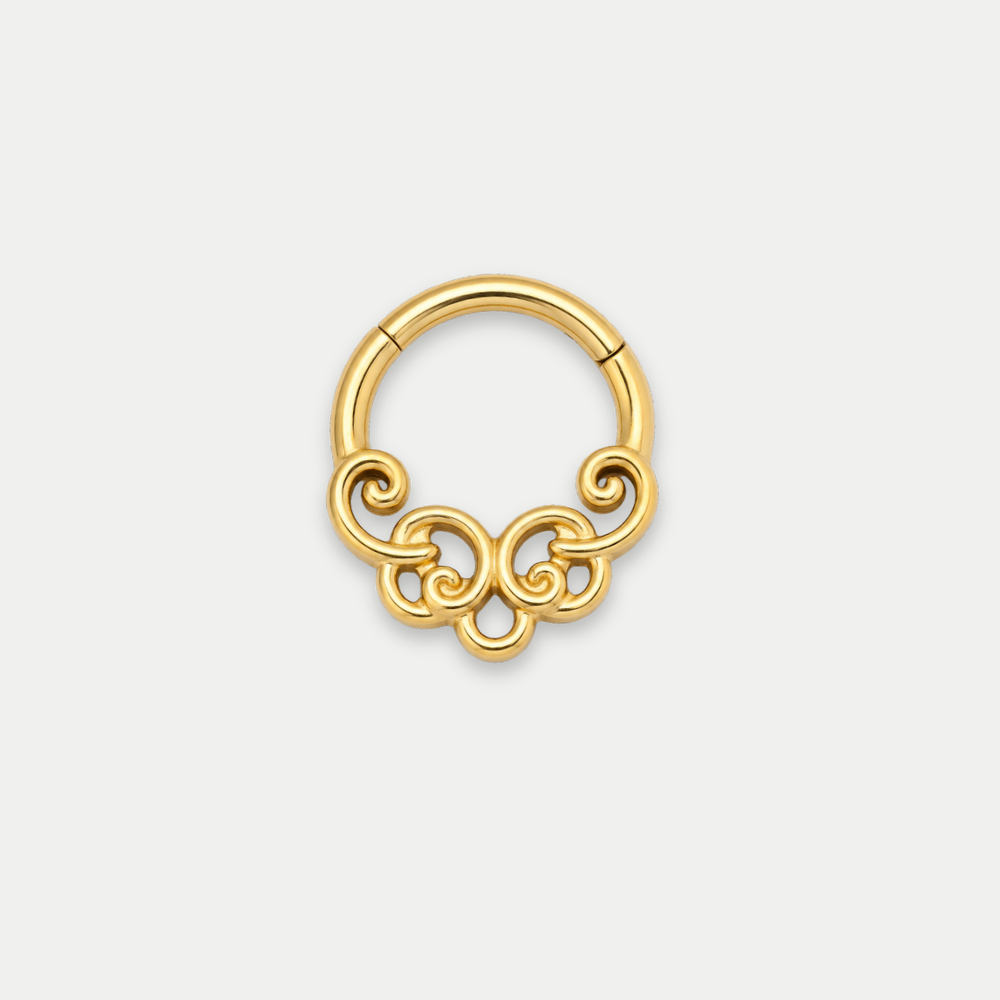Anneau piercing Spira en titane gold, motif de volutes entrelacées, vu de face