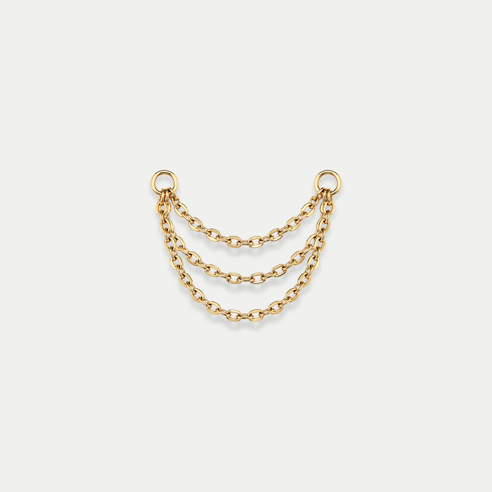 Chaîne triple de piercing en titane gold avec trois rangées reliées entre deux anneaux