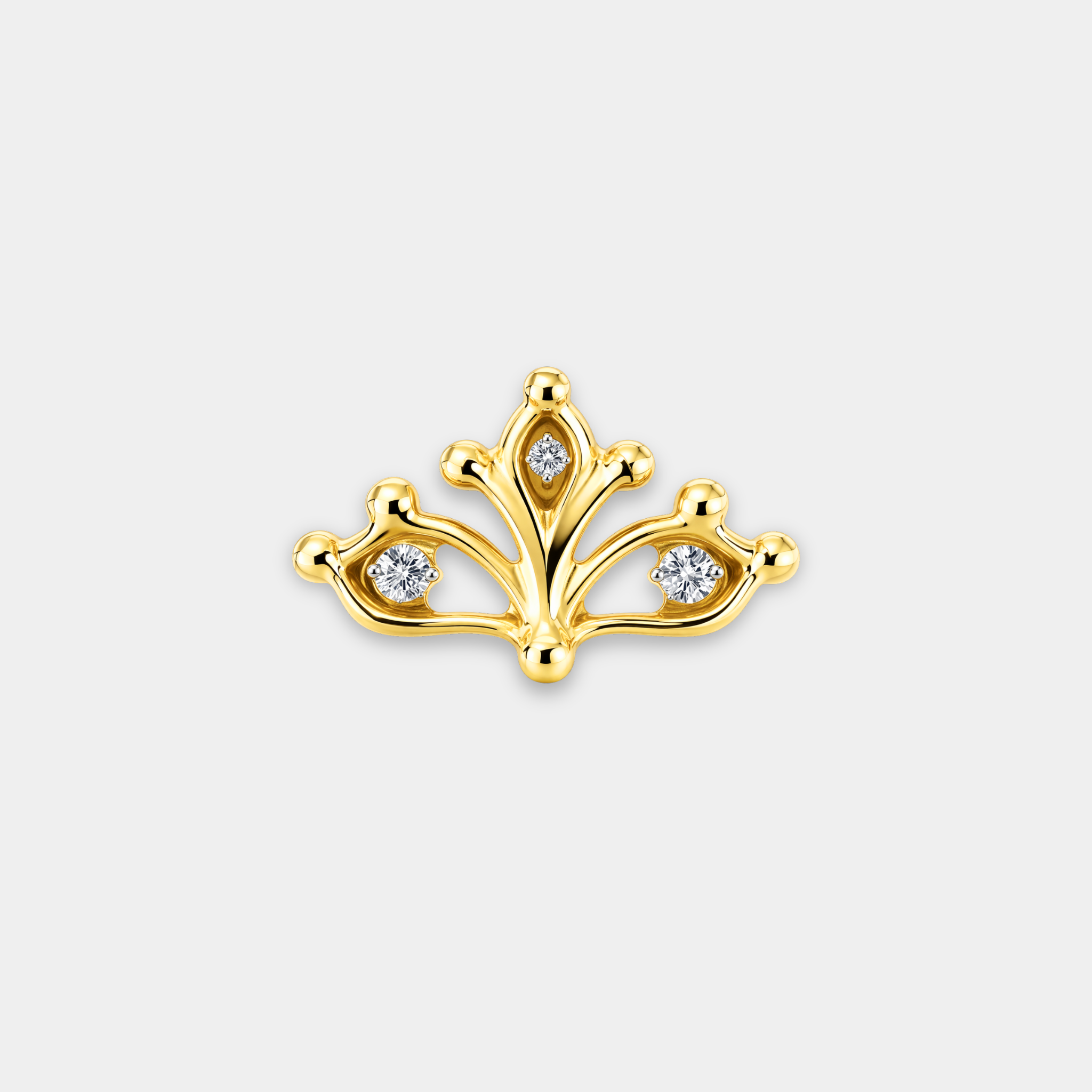 Embout piercing Helia en titane gold avec trois zircons sertis et motif ajouré de face