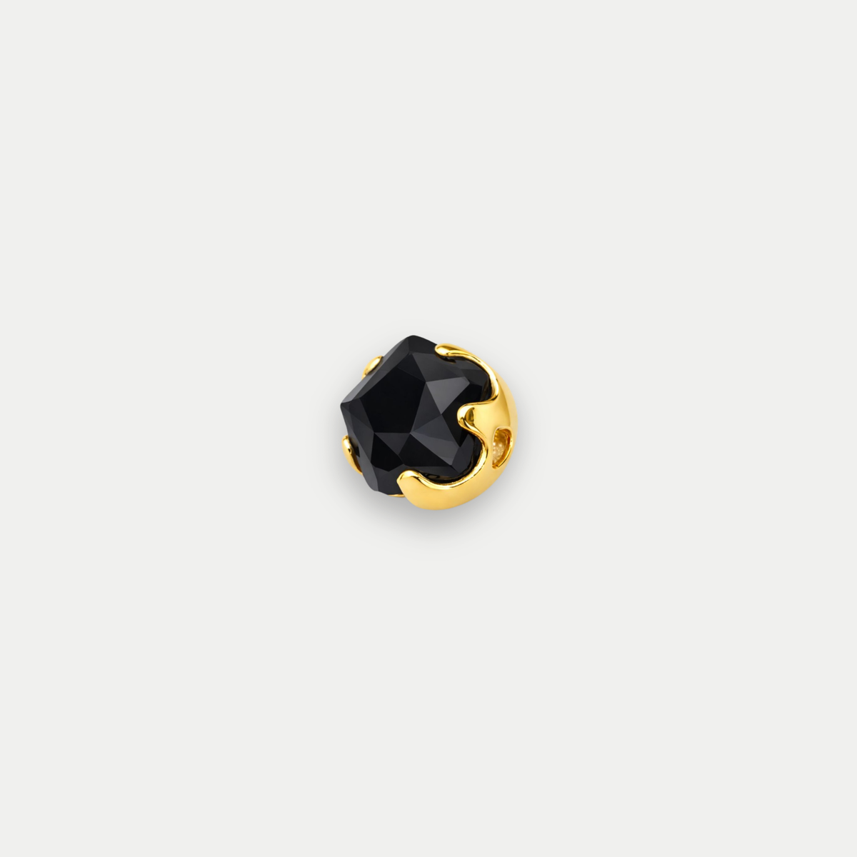 Embout piercing Iriséa en titane gold avec zircon noir, vu de face