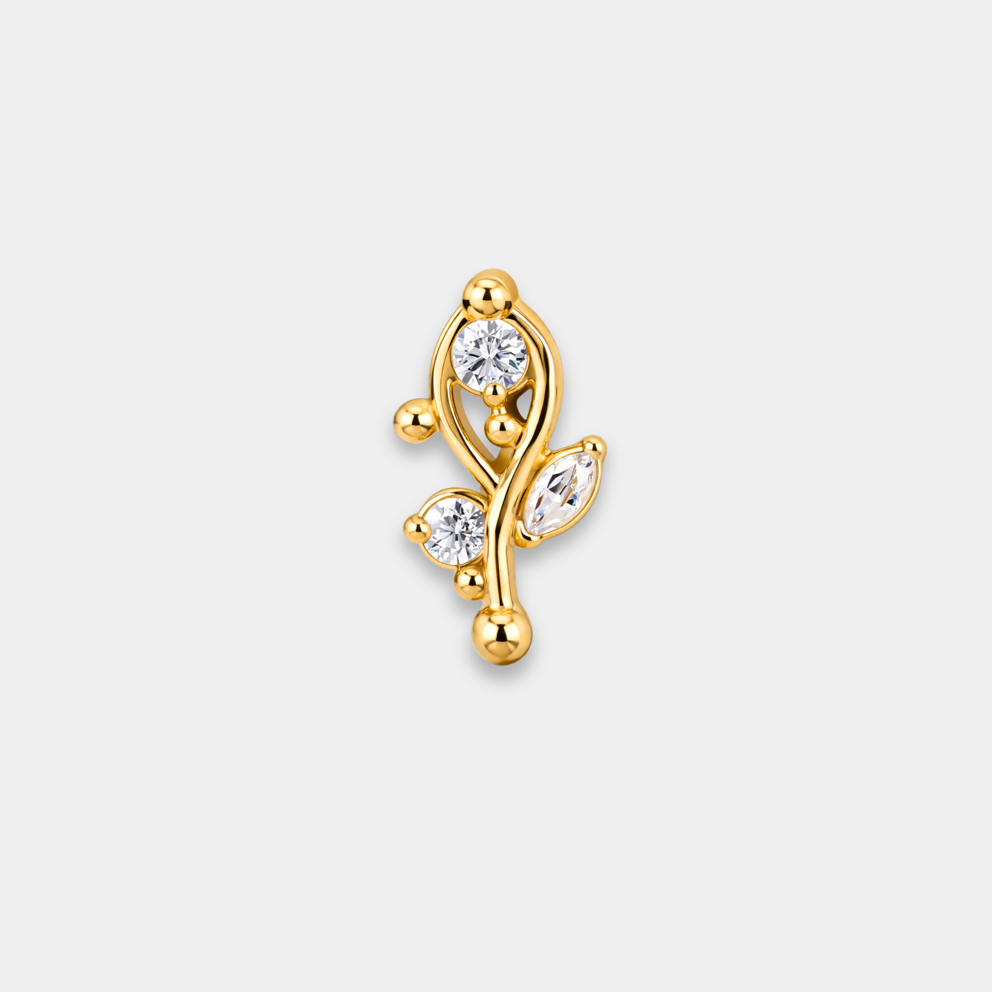 Embout piercing Luma en titane gold avec deux zircons ronds sertis, une pierre marquise et courbes délicates de face