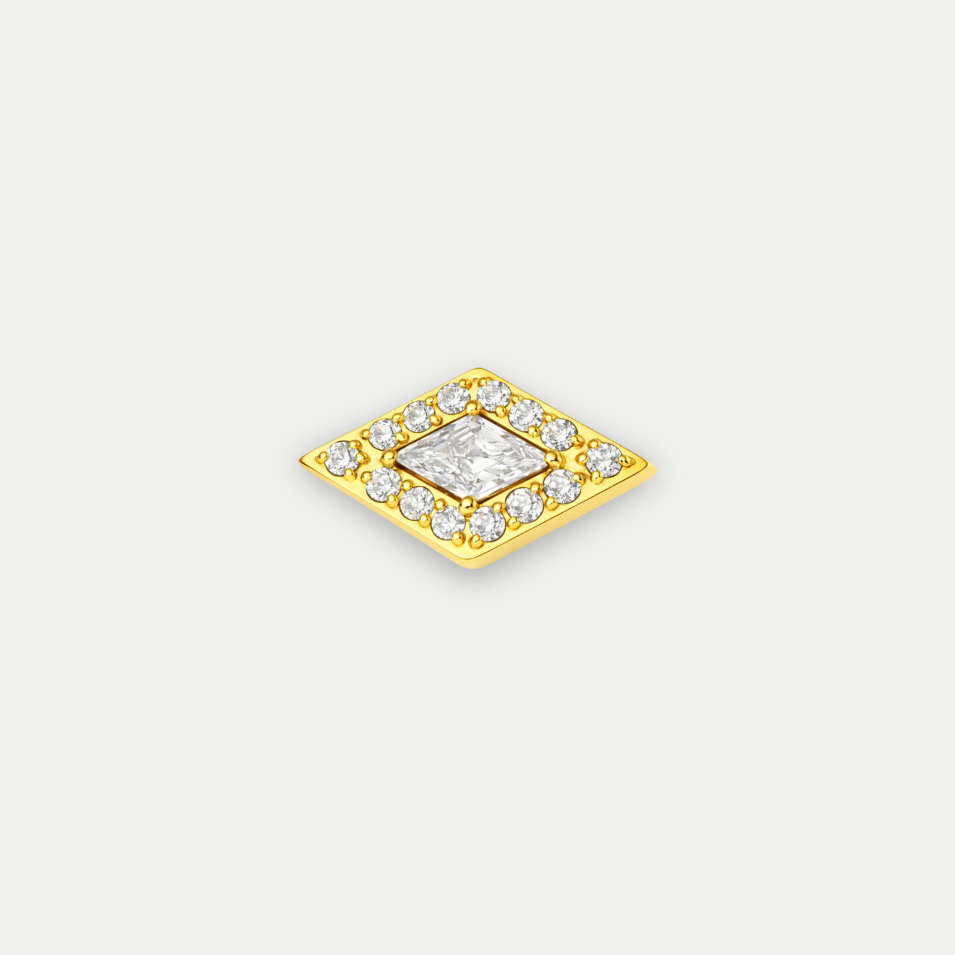 Embout de piercing en titane gold avec zircon central en forme de losange entouré de petits zircons
