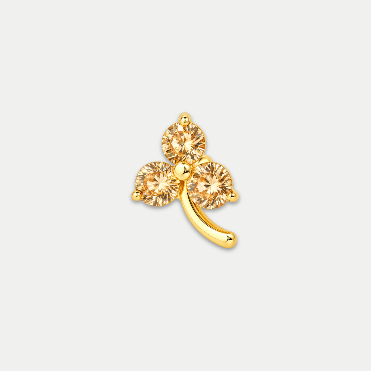 Embout piercing Nika en titane gold avec zircon orange, vu de face