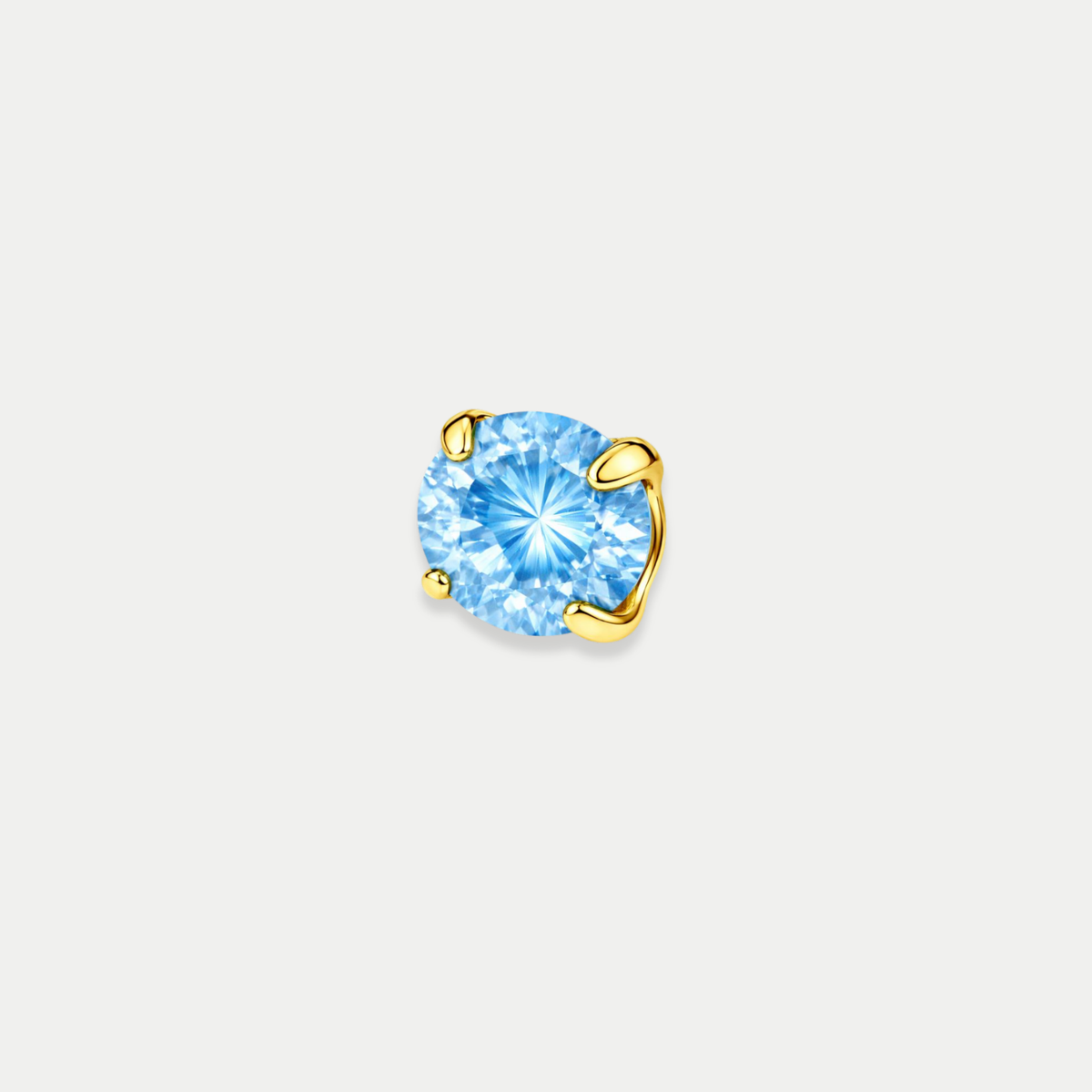 Embout piercing Nita en titane gold avec zircon bleu, vu de face