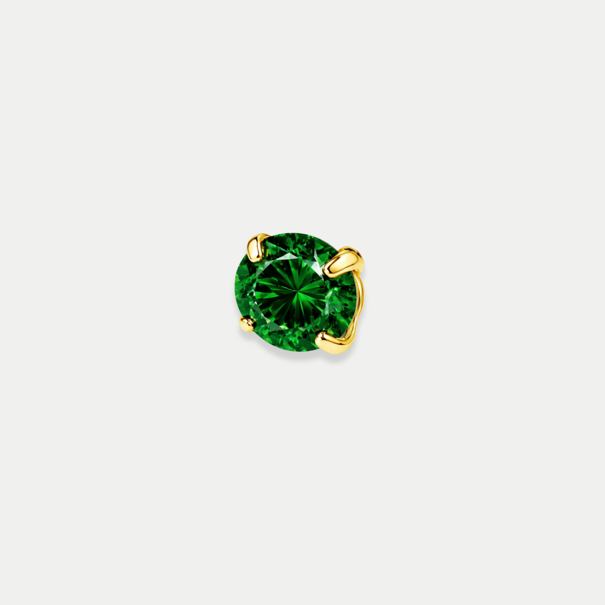 Embout piercing Nita en titane gold avec zircon vert, vu de face
