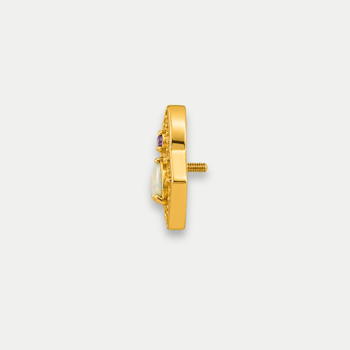 Embout piercing Noma en titane gold avec zircon violet et pierre naturelle nacre abalone, vu de côté