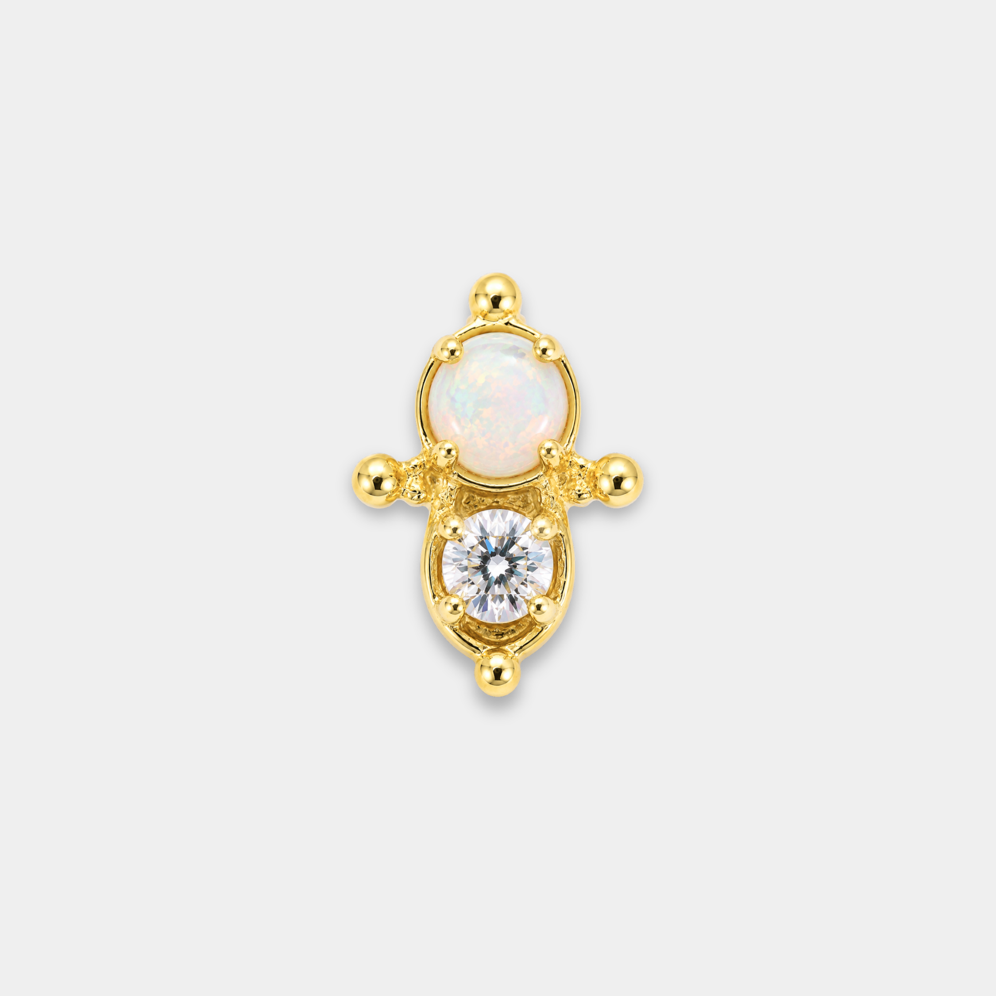 Embout piercing Nura en titane gold avec opale blanche lumineuse, zircon rond serti et détails perlés délicats de face