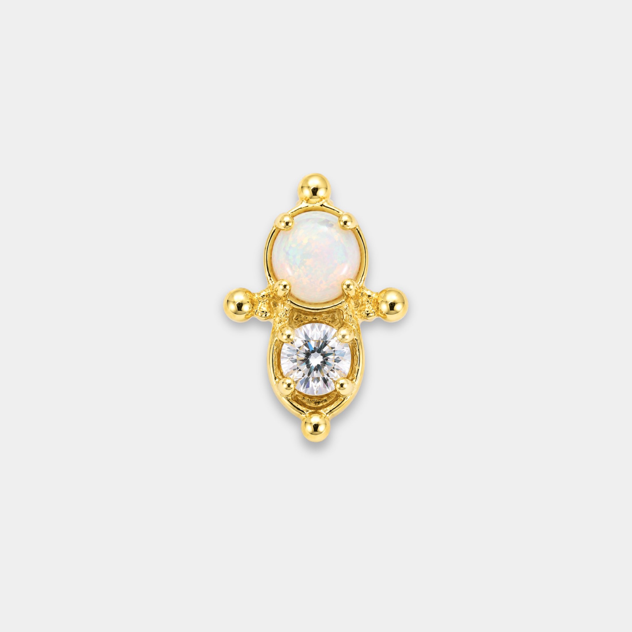 Embout piercing Nura en titane gold avec opale blanche lumineuse, zircon rond serti et détails perlés délicats de face