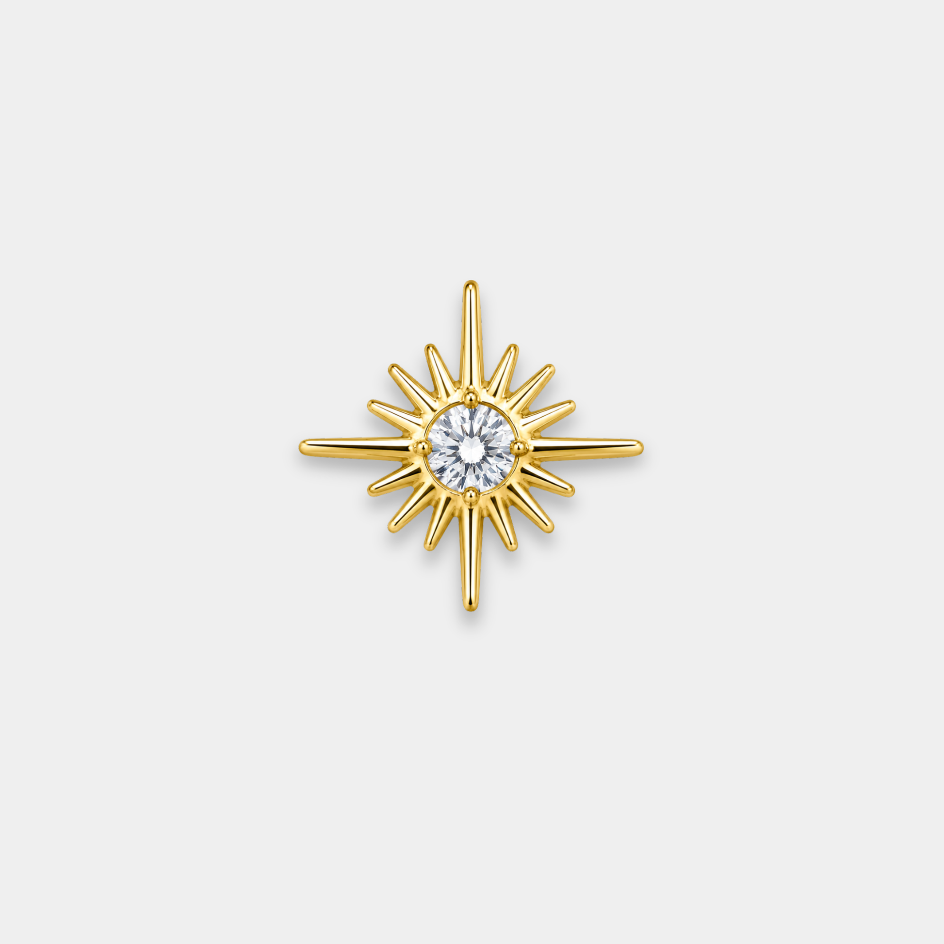Embout piercing Solaris en titane gold avec zircon blanc central et motif étoile soleil de face