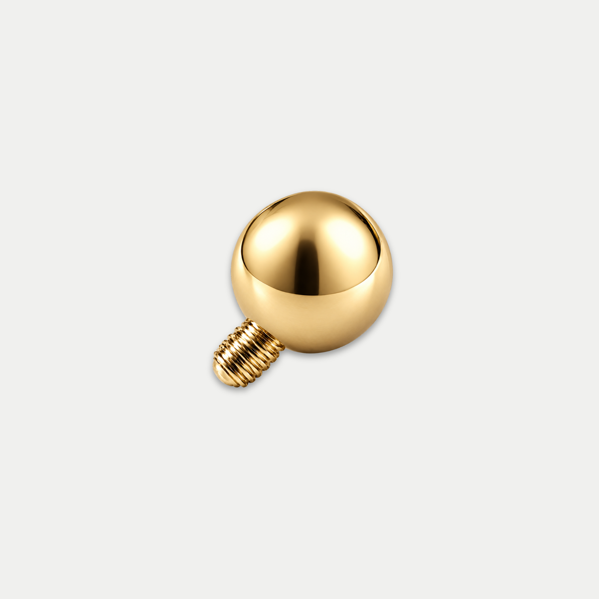 Embout piercing en titane gold avec bille, vu de côté