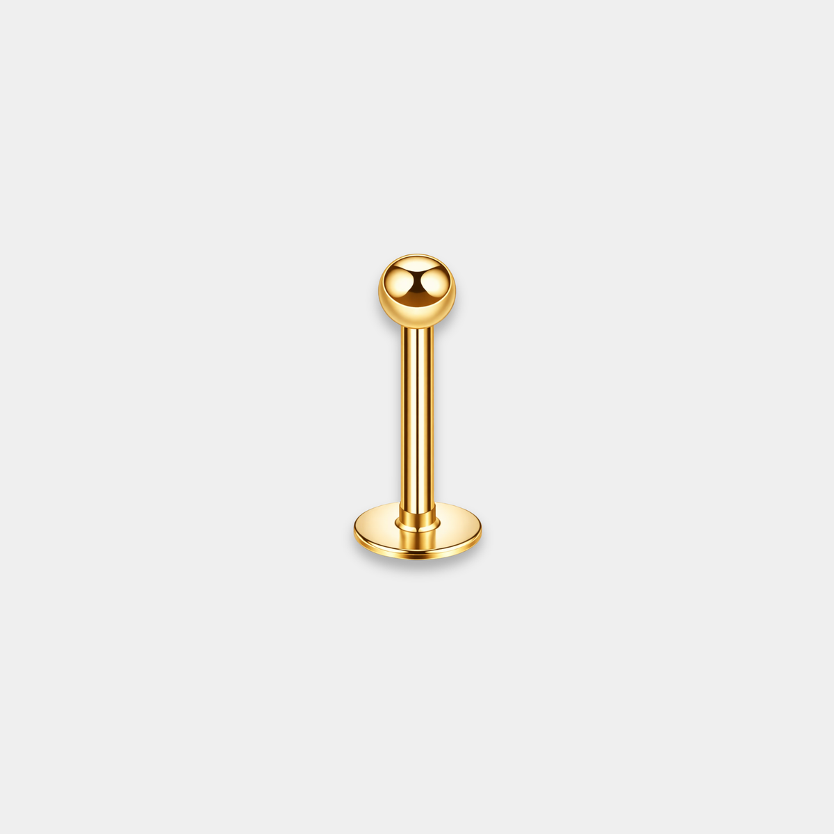 Labret piercing en titane gold avec bille, vu de côté